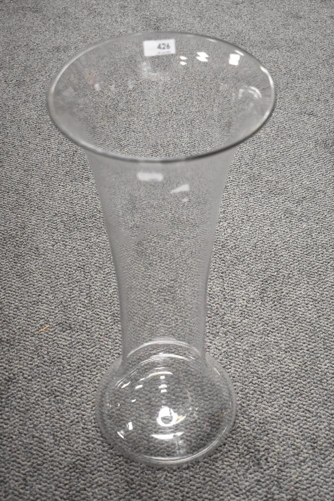 A modern large floor standing hand blown glass vase of fluted bell form 60cm tall.