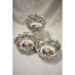 A group of three 'Royal Europe' ceramic baskets, decorated in the 19th century manner with foliate