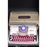 A Mettoy Elegant tin plate Typewriter, in original box