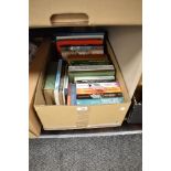 A carton of mainly easy reading books including The Hunger Games 1-3, The Steel Bonnets and Arthur C