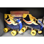 A pair of children's vintage roller skates, marked 6 to base, with their original box