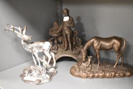 A bronze effect moulded resin study of a horse and foal, A vintage cast metal figurine of a man