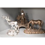 A bronze effect moulded resin study of a horse and foal, A vintage cast metal figurine of a man