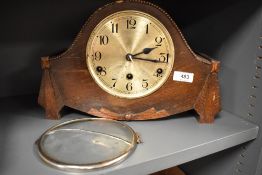 A 1930s hump back mantel clock, AF.