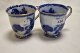 Two 19th century blue and white transfer pattern tea cups, having gilt heightening, AF.