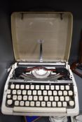 A vintage Brother typewriter in hard case.