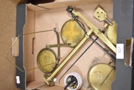 A deconstructed brass scale.