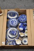 A carton of blue and white tableware including plates, dished and cups.