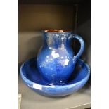 An earthenware jug and basin set, having blue and brown glaze, AF.