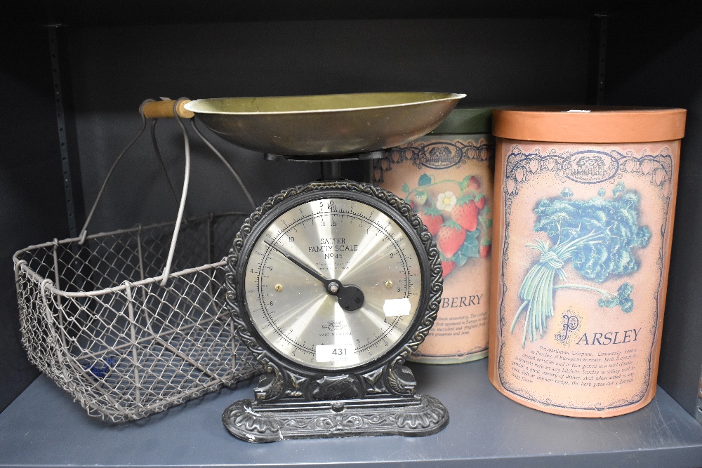 A set of traditionally styled Salter scales, an egg basket and two cylindrical cardboard