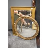 Two gilt framed wall mirrors.