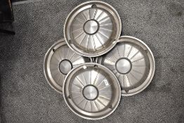 Five hub caps, thought to be Rover P6 or similar.