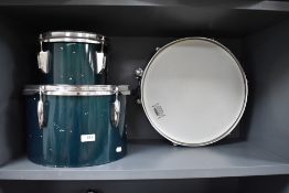 Two Olympic tom style (32 and 22cm diameter) and an unbranded snare drum.