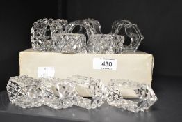 Two sets of six crystal glass napkin rings