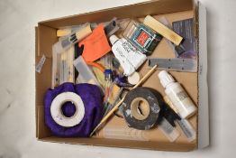 A selection of various reeds etc including valve oil and grease.