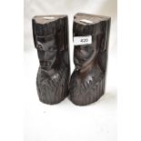 A pair of mid century carved wood African heads.