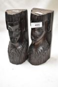 A pair of mid century carved wood African heads.