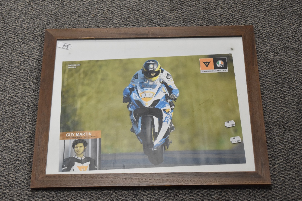 A framed print of Guy MArtin.