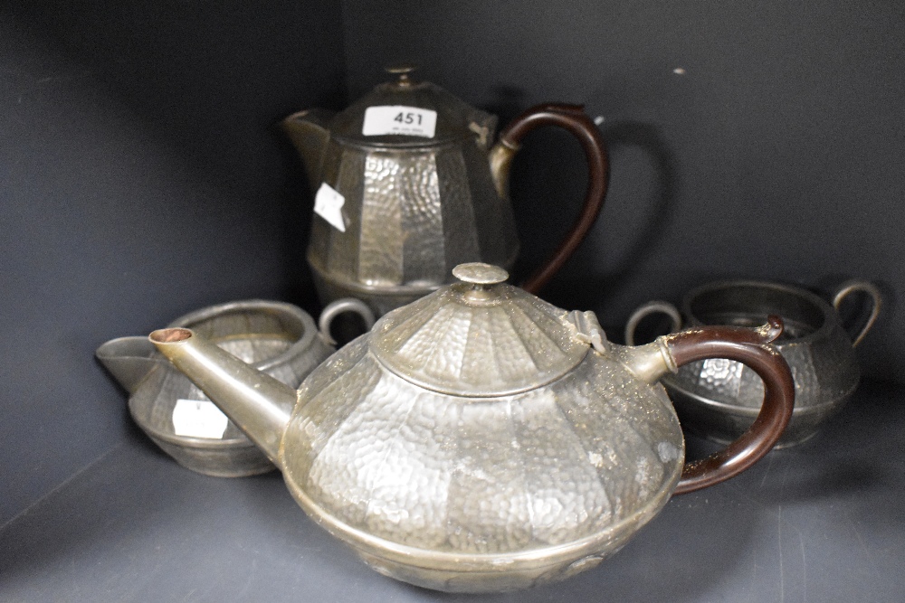 An early 20th century pewter teapot, coffeepot, sugar and creamer.