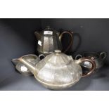 An early 20th century pewter teapot, coffeepot, sugar and creamer.