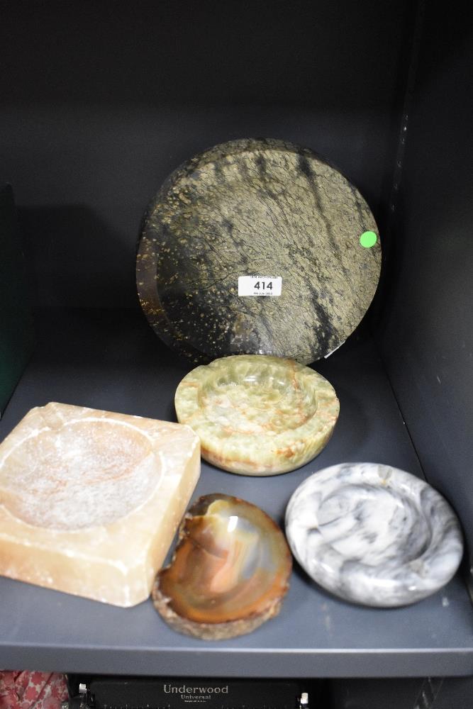 Five stone ashtrays of different forms, to include a circular onyx ashtray