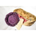 A pair of vintage suede gloves, a 1960s purple feathered hat and an as new faux fur scarf, having