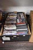 A carton of assorted dvds mainly films including James Bond collection, Rush Hour collection, The