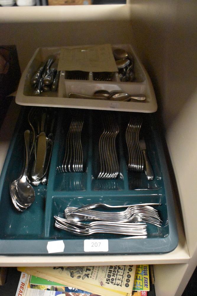 Two plastic trays of stainless steel cutlery, to comprise Viners and Sant Andrea 8 place settings