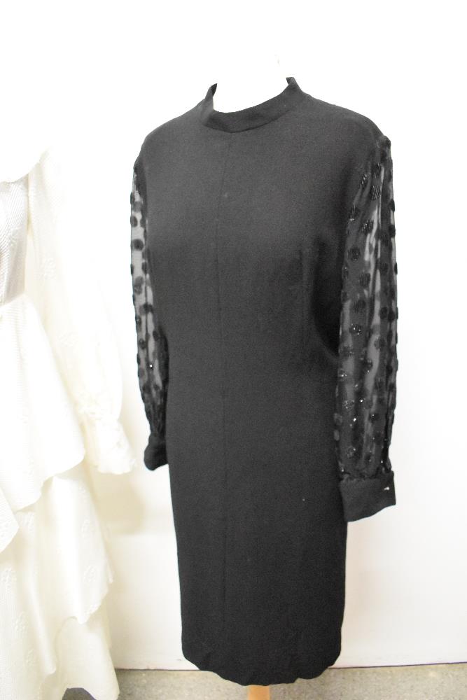 Two vintage dresses, comprising black wool crepe with sheer sleeves and white 1960s/70s with - Image 4 of 5