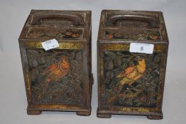 A pair of late19th/early 20th century embossed tin tea canisters, decorated with exotic birds and
