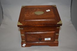 A hard wood desk top box, having drawer and hinged lid, with metal brackets to sides.