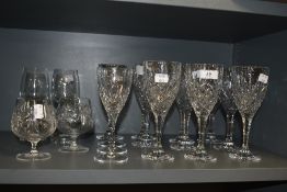 A collection of cut and pressed glass, including Royal Doulton wine glasses and Bohemia lead crystal