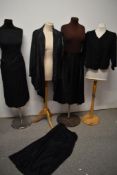 A varied lot of vintage skirts and jackets, various styles and eras, including 1940s grosgrain