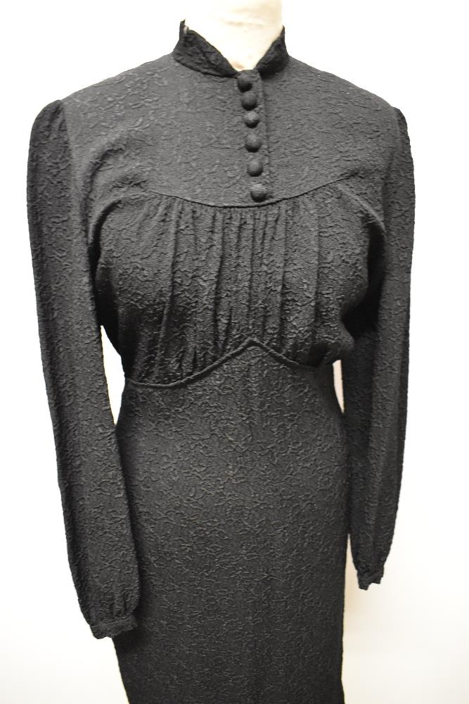 A 1930s/ 1940s textured day dress in black, having wide sleeves gathering into a fitted cuff, - Image 2 of 8