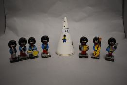 Seven vintage Robertsons jam figures and a bone china sugar sifter.