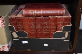 Ten red leather bound volumes of The Children's Encyclopedia by Arthur Mee