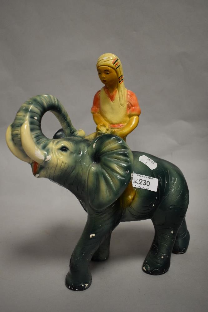 A 1930s Art Deco chalkware elephant and rider.