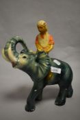 A 1930s Art Deco chalkware elephant and rider.