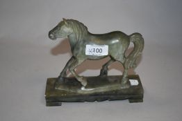 A 20th century carved natural green stone horse on plinth, AF, (loose from plinth).