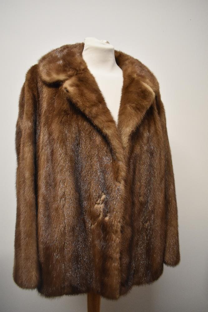 A vintage caramel mink jacket having 'M J L' monogrammed to lining.