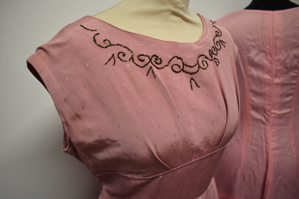 A 1950s grosgrain dress in rose pink, having full pleated skirt, beading to bust and half belt to - Image 8 of 8