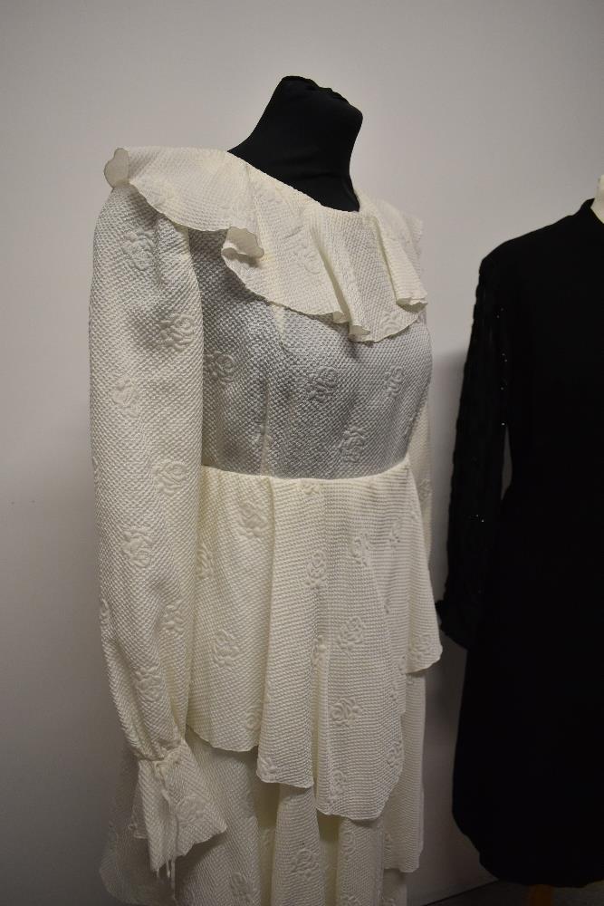 Two vintage dresses, comprising black wool crepe with sheer sleeves and white 1960s/70s with - Image 3 of 5