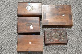 Five early 20th century wooden boxes, including inlaid and carved examples.