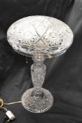 An early 20th Century cut glass table lamp, of mushroom form, measuring 55cm tall