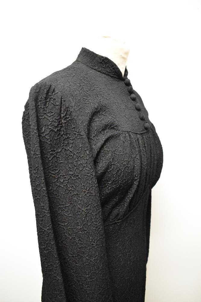 A 1930s/ 1940s textured day dress in black, having wide sleeves gathering into a fitted cuff, - Image 4 of 8