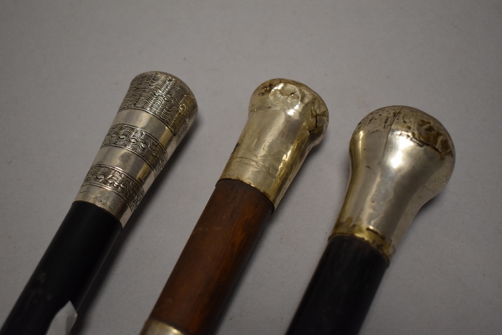 A group of three late 19th/early 20th silver topped walking canes, each of traditional design and - Image 2 of 3