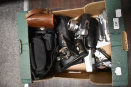 An assorted collection of vintage cameras, binoculars, and a camcorder, to include a Halina