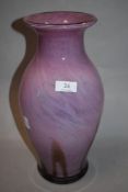 A pink art glass vase having brown and blue mottled effect, in the manner of Monart / Vasart, approx