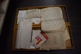 An assorted collection of paper ephemera, displayed in a wooden hinged box, to include Canadian