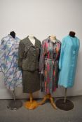A mixed lot of vintage clothing, to include 1960s skirt suit, 1970s floral dress, 1970s paisley